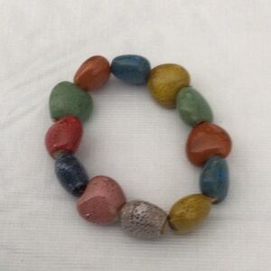Woman’s Stretch Bracelet made of colored Stones green, red, blue, gold & tan